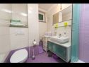 Apartmány Palmina - comfort apartment: A1 veliki (6),  A2 žuti (4+1), A3 lila (2), SA4 bijeli (2) Makarska - Riviera Makarska  - Apartmán -  A2 žuti (4+1): koupelna s WC