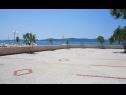Apartmány Sor - on the beach: SA1(2+1), A1(4+1), A2(2+2), A3(2+2) Bibinje - Riviera Zadar  - parkovište (dům a okolí)